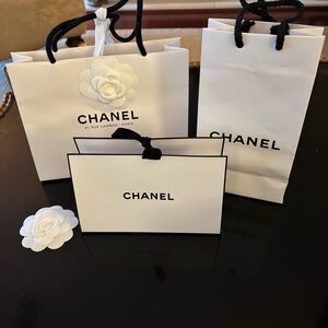Three small Chanel White Bags